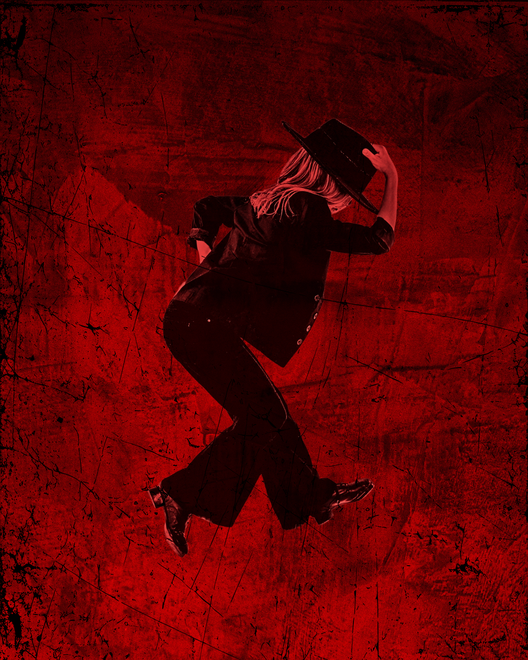 Profile of female dancer wearing black hat with red lighting and red background