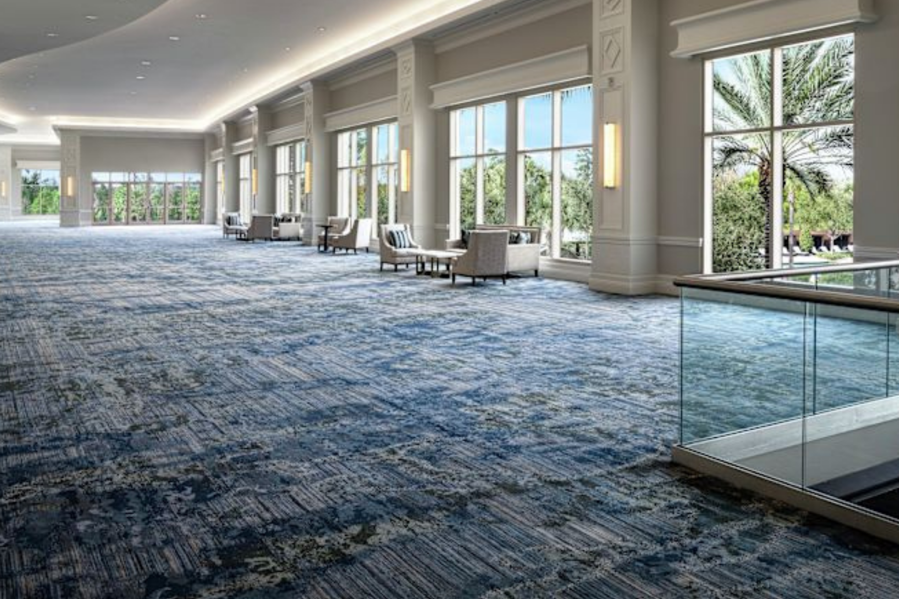Event space with blue carpet and large windows