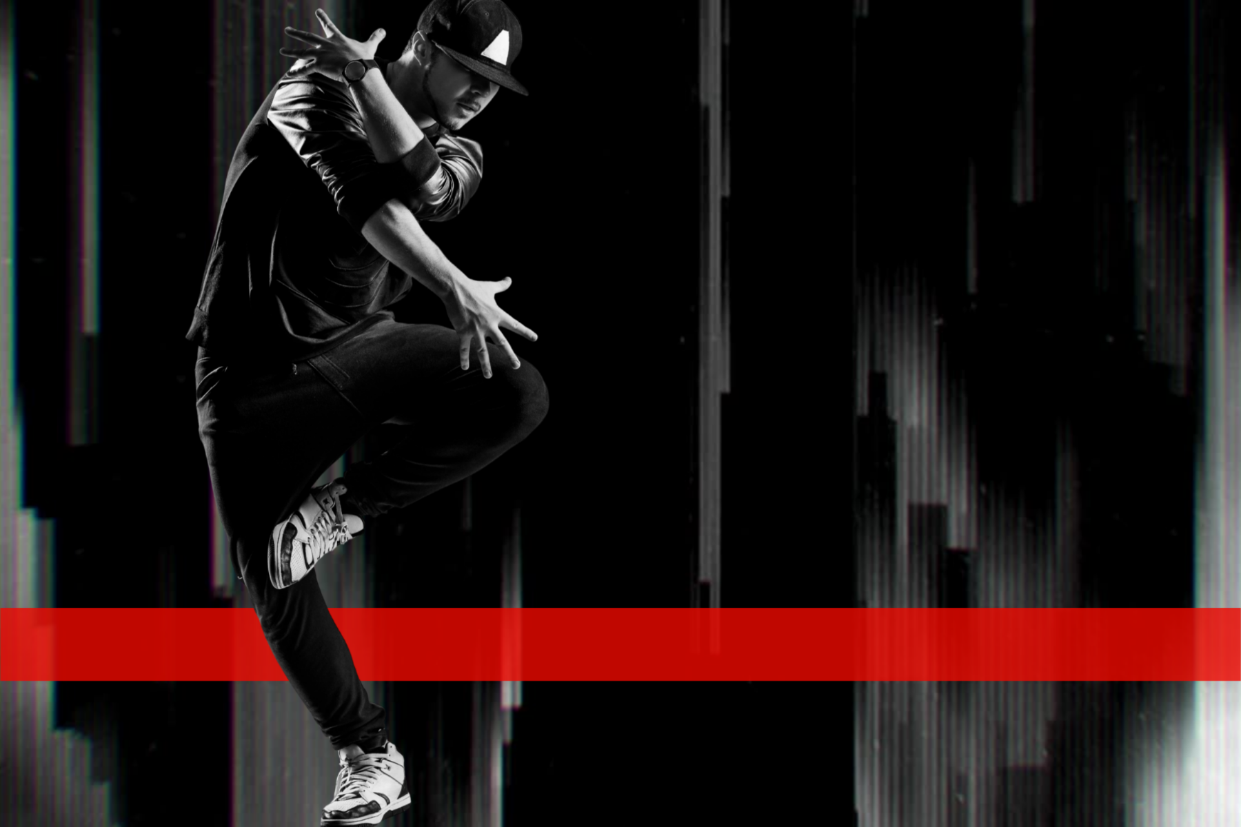 Black and white male dancer with horizontal red stripe in the background