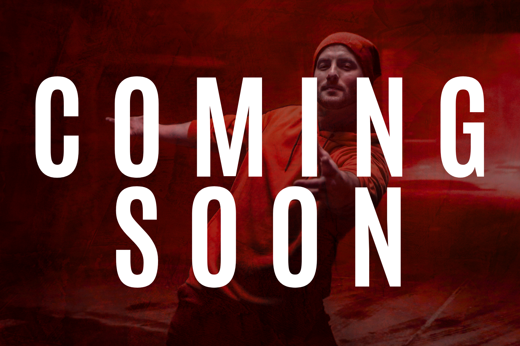 White coming soon text on image of dancer with red lighting