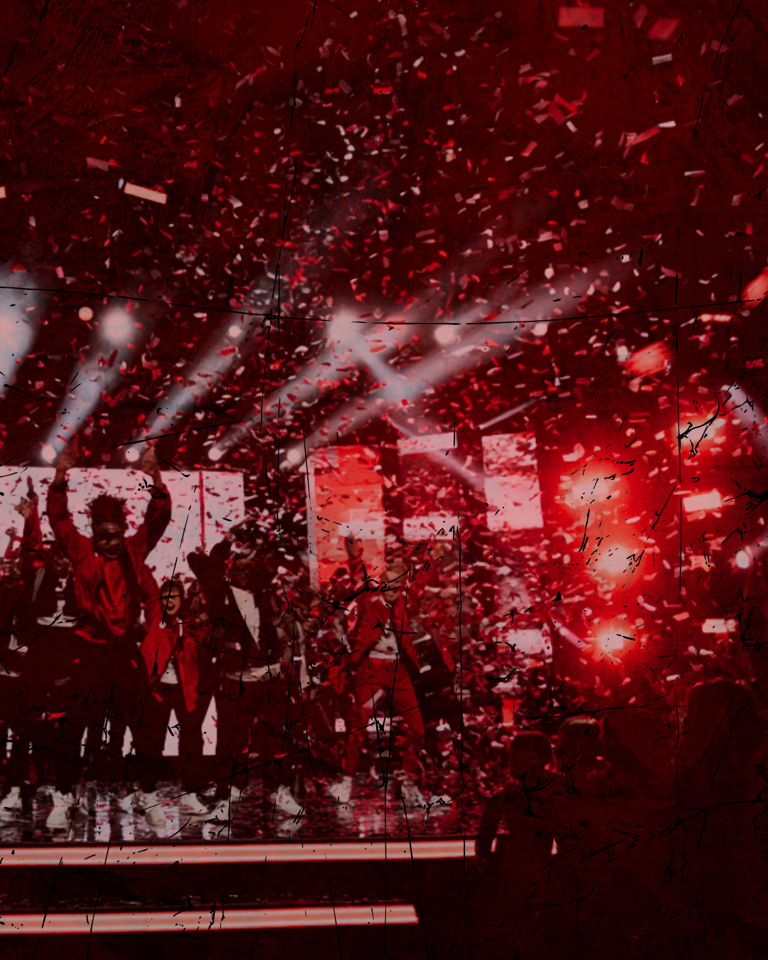 Group of dancers celebrating with confetti falling around them
