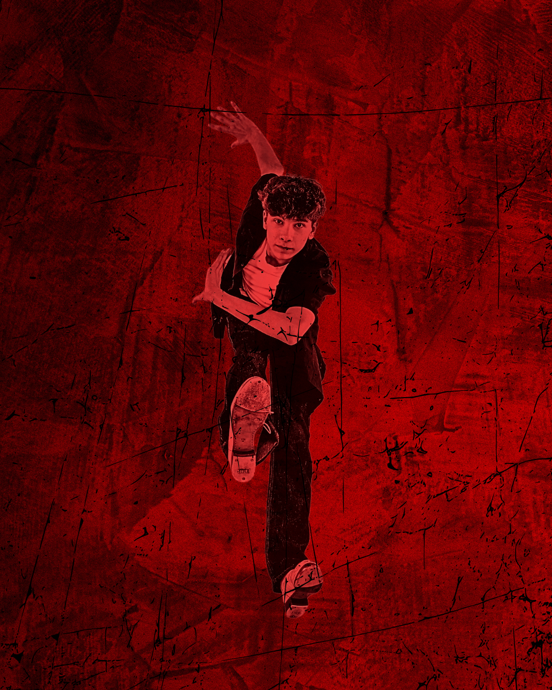 Male dancer posed with legs forward with red lighting and red background